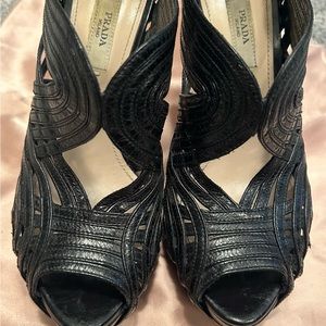 Prada leather platform heels with gold zipper at heel